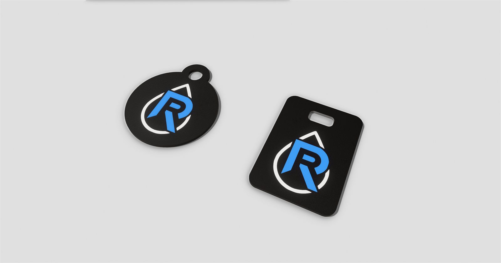 CAD render of two custom logo keychains