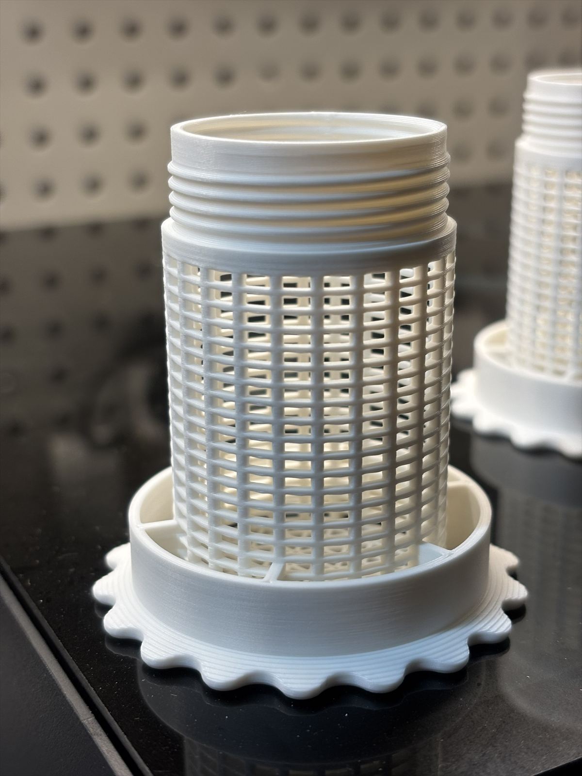 White threaded bead holder with mesh pattern